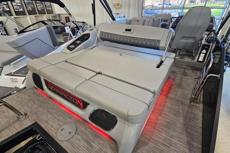 Slide: The Image of 2020 Bennington 23 R Swingback boat interior with luxurious seating and ambient lighting. - 7