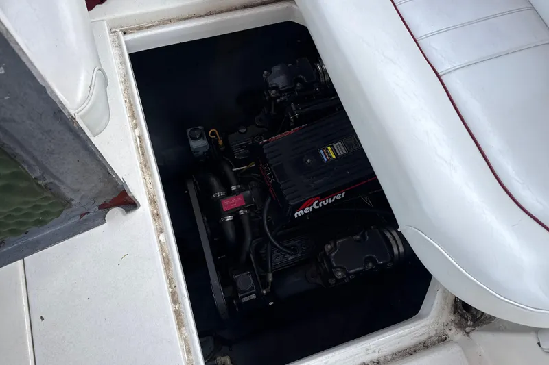 Slide: The Image of Engine compartment of a 1996 Sea Ray 240 Sundancer with MerCruiser engine visible. - 14
