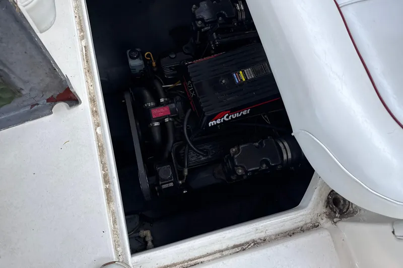 Slide: The Image of Engine compartment of a 1996 Sea Ray 240 Sundancer with MerCruiser engine visible. - 15