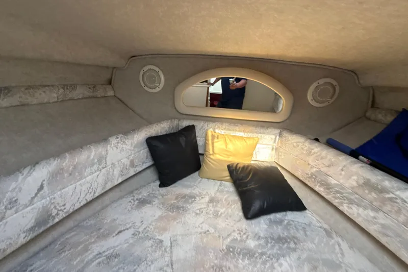 Slide: The Image of Interior cabin of 1996 Sea Ray 240 Sundancer with cushions and speakers. - 41