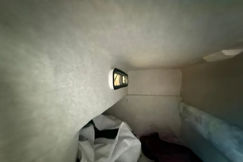 Slide: The Image of Interior cabin view of a 1996 Sea Ray 240 Sundancer boat. - 45