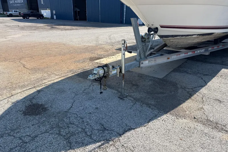 Slide: The Image of 1996 Sea Ray 240 Sundancer on trailer in marina parking lot. - 8