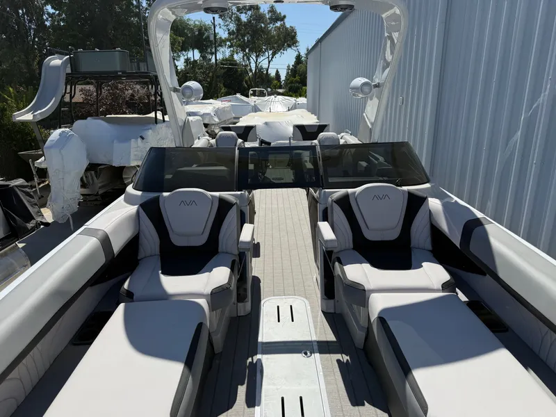 Slide: The Image of Luxurious Avalon Carbon Series boat with quad lounger, 2026 model. - 7