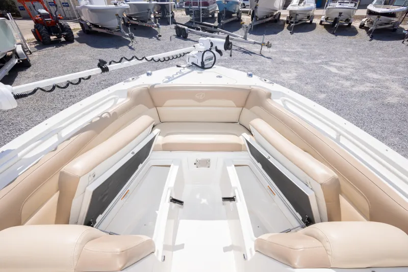 Slide: The Image of 2018 Sailfish 245 DC boat interior with beige seating, showcasing spacious and comfortable design. - 29