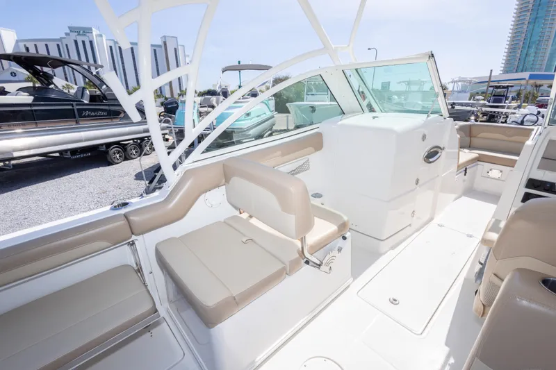 Slide: The Image of 2018 Sailfish 245 DC boat interior with beige seating and modern design. - 32