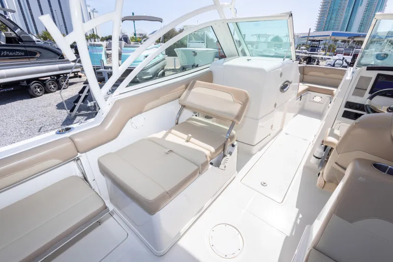 Slide: The Image of 2018 Sailfish 245 DC boat interior with beige seating and modern design. - 33