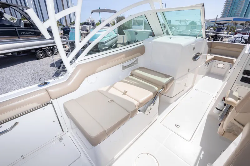 Slide: The Image of 2018 Sailfish 245 DC boat interior with beige seating and modern design. - 35