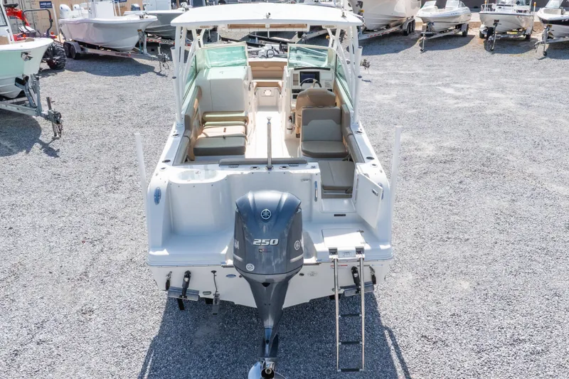 Slide: The Image of 2018 Sailfish 245 DC boat with Yamaha 250 engine, parked on gravel lot. - 41