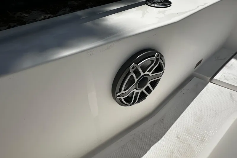 Slide: The Image of Speaker on 2018 Axopar 37 Sun-Top boat, mounted on white surface. - 48