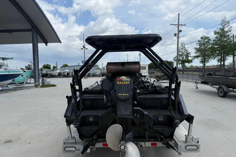 Slide: The Image of Rear view of a 2024 Prodigy 17 boat with a powerful motor, parked outdoors. - 4