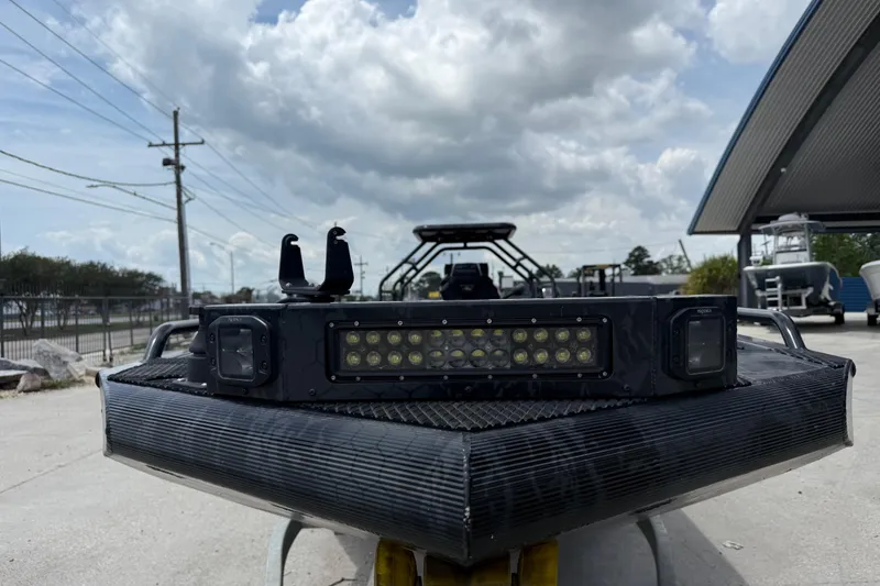 Slide: The Image of Front view of 2024 Prodigy 17 boat with LED light bar under cloudy sky. - 8