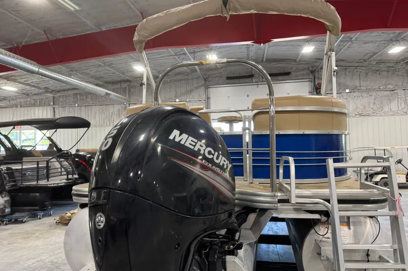Slide: The Image of 2017 Lowe SS 250 pontoon boat with Mercury outboard motor in a showroom. - 5