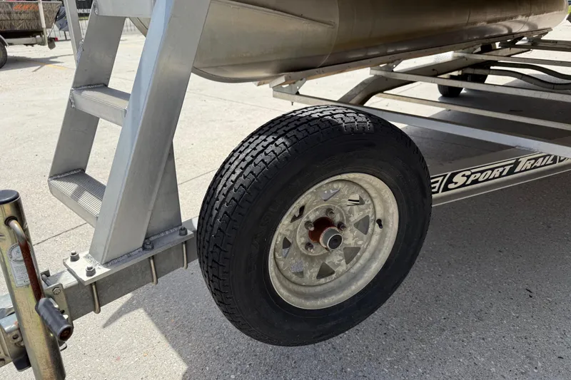 Slide: The Image of Trailer wheel and ladder of a 2012 South Bay 522 CR boat. - 10