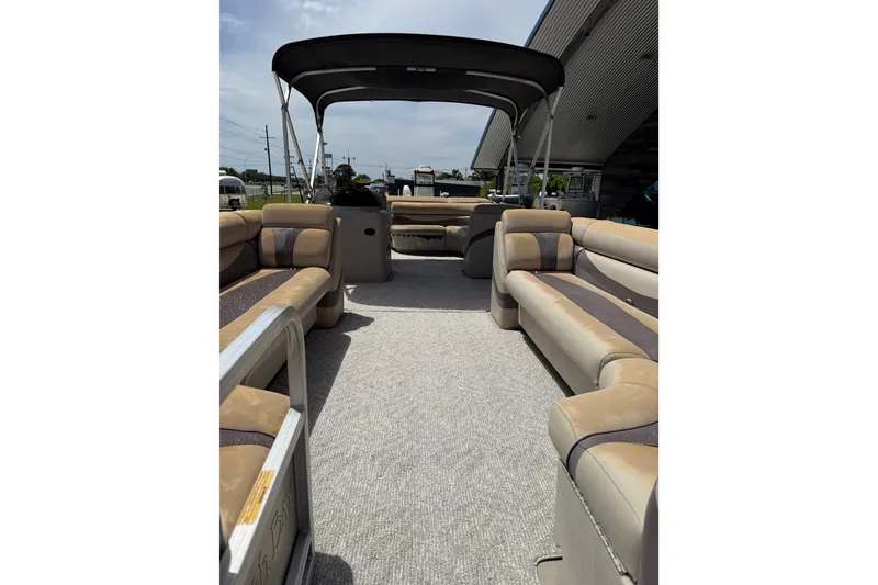 Slide: The Image of 2012 South Bay 522 CR pontoon boat interior with spacious seating and canopy. - 11