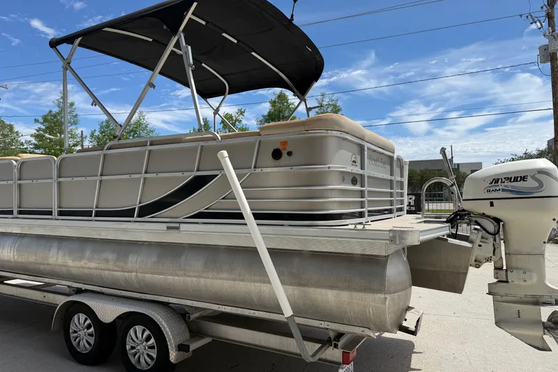 Slide: The Image of 2012 South Bay 522 CR pontoon boat on trailer with Evinrude outboard motor. - 5