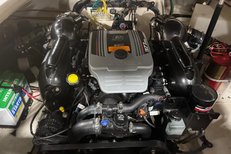Slide: The Image of Engine compartment of a 2010 Chaparral 256 SSX boat, featuring a MerCruiser 377 MAG engine. - 14