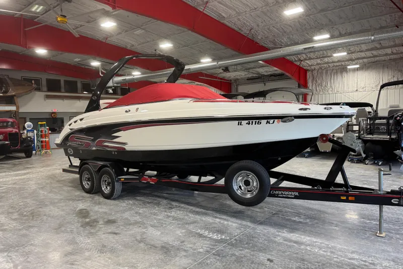 Slide: The Image of 2010 Chaparral 256 SSX boat on trailer in indoor storage facility. - 15