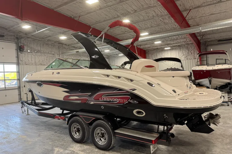 Slide: The Image of 2010 Chaparral 256 SSX boat on trailer in indoor storage facility. - 3