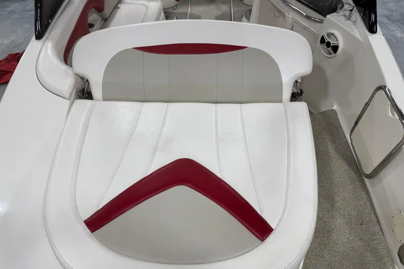 Slide: The Image of 2010 Chaparral 256 SSX boat interior with white and red seating. - 8