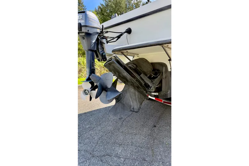 Slide: The Image of Rear view of a 2006 Osprey Legend boat with Yamaha outboard motor and propeller. - 22