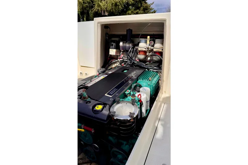 Slide: The Image of Engine compartment of a 2006 Osprey Legend boat, showcasing detailed mechanical components. - 9