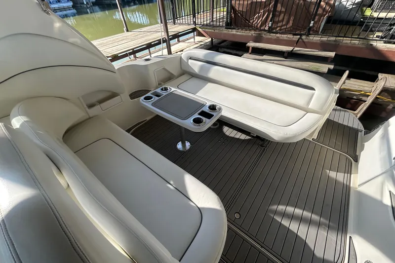 Slide: The Image of Helm of 2004 Sea Ray 360 Sundancer with wooden steering wheel and navigation controls. - 12