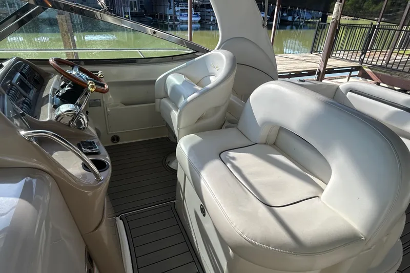 Slide: The Image of Interior of 2004 Sea Ray 360 Sundancer yacht with beige seating and steps. - 15
