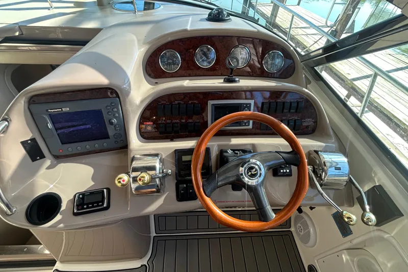 Slide: The Image of 2004 Sea Ray 360 Sundancer interior with kitchenette and cozy sleeping area. - 16