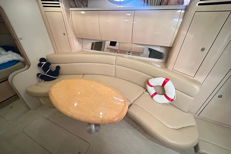 Slide: The Image of Interior of 2004 Sea Ray 360 Sundancer yacht with modern kitchen and seating area. - 19