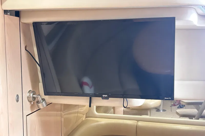 Slide: The Image of Luxurious cabin interior of 2004 Sea Ray 360 Sundancer with cozy bedding and mirrored closet. - 22