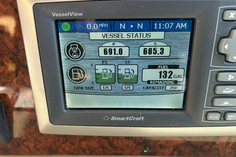 Slide: The Image of VesselView display on 2004 Sea Ray 360 Sundancer showing fuel status and engine hours. - 34