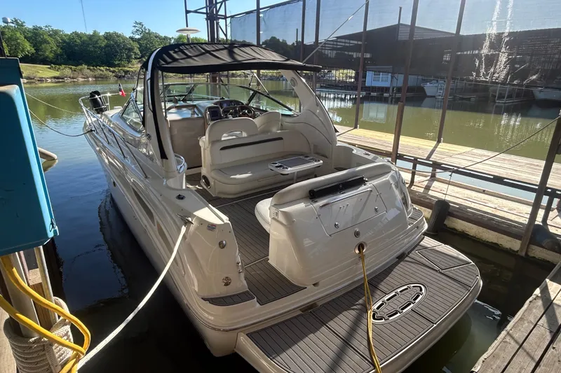 Slide: The Image of 2004 Sea Ray 360 Sundancer boat deck with stainless steel rail and speaker system. - 7