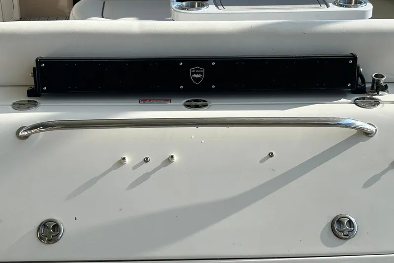 Slide: The Image of 2004 Sea Ray 360 Sundancer boat interior with seating and table, docked by the water. - 9