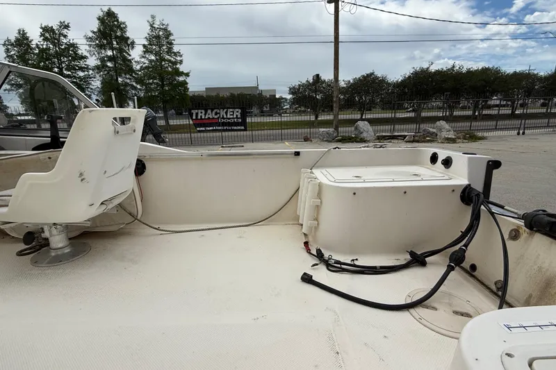 Slide: The Image of 2001 Key West 1720 Dual Console boat interior with seating and storage compartments. - 14