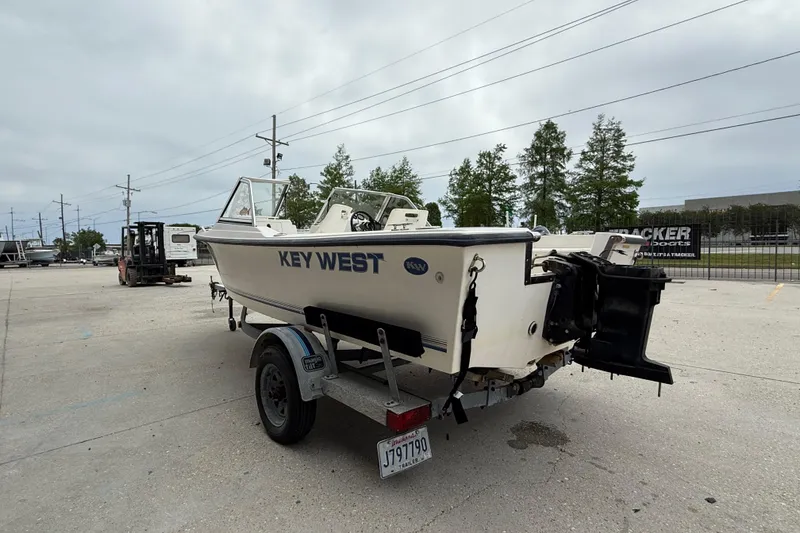 Slide: The Image of 2001 Key West 1720 Dual Console boat on trailer in parking lot. - 5