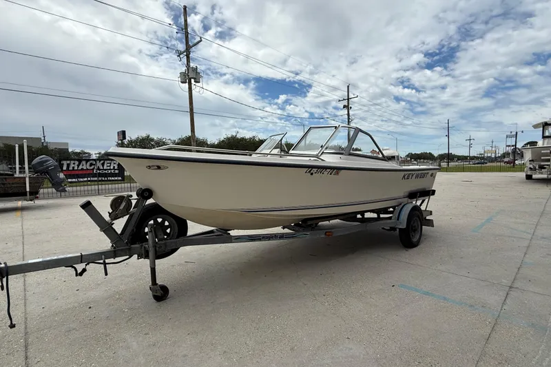 Slide: The Image of 2001 Key West 1720 Dual Console boat on trailer under cloudy sky. - 7