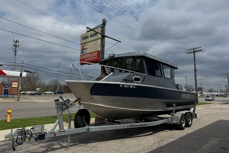 The Image of 2025 Hewescraft 240 Pacific Cruiser on trailer at Parma Marine dealership. - 1