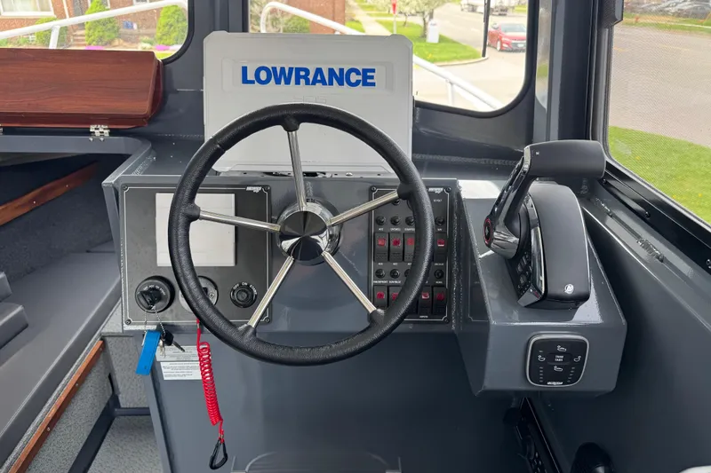Slide: The Image of Steering console of 2025 Hewescraft 240 Pacific Cruiser with Lowrance navigation system. - 19