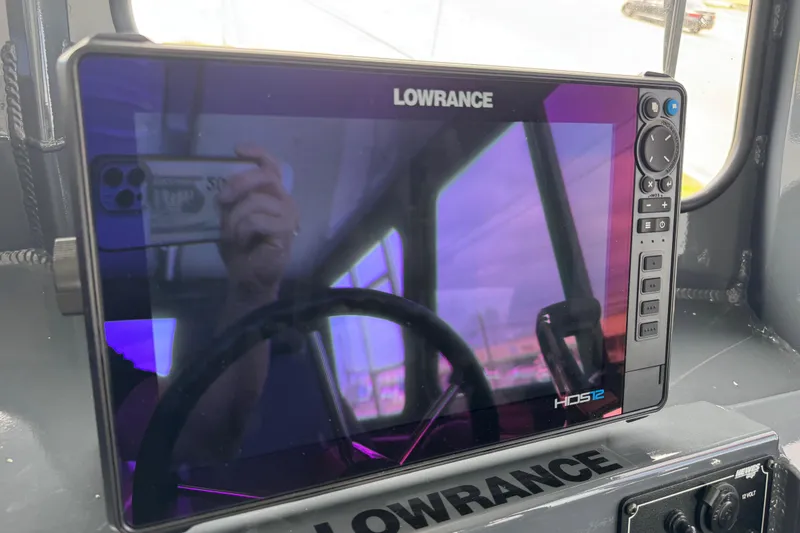 Slide: The Image of Lowrance HDS12 display on 2025 Hewescraft 240 Pacific Cruiser dashboard. - 21