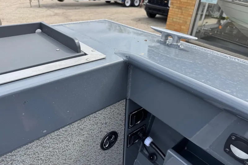 Slide: The Image of 2025 Hewescraft 240 Pacific Cruiser boat detail, featuring sleek gray finish and hardware. - 25