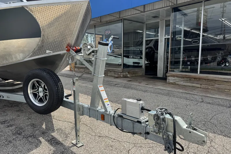 Slide: The Image of 2025 Hewescraft 240 Pacific Cruiser on trailer outside dealership. - 3