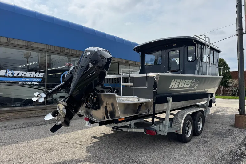 Slide: The Image of 2025 Hewescraft 240 Pacific Cruiser boat on trailer outside dealership. - 4