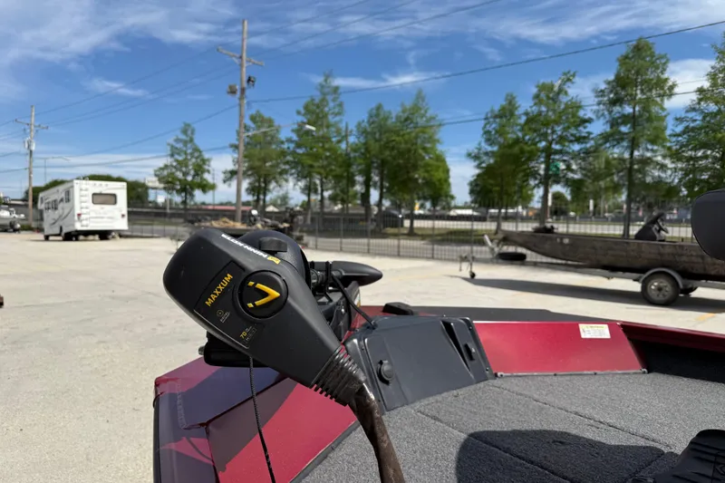 Slide: The Image of 2023 Crestliner 1850 SC boat with Maxxum trolling motor in a parking lot. - 10