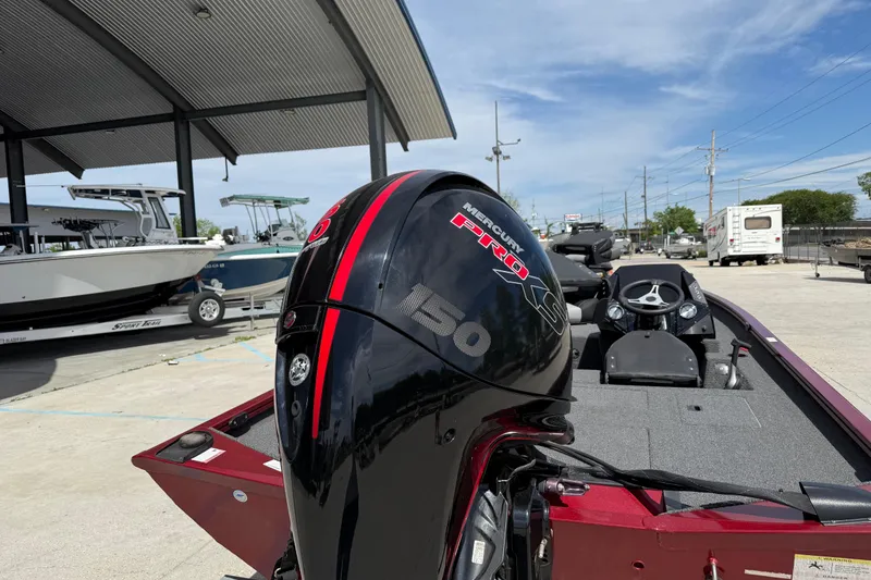 Slide: The Image of 2023 Crestliner 1850 SC boat with Mercury Pro 150 engine at a marina. - 5