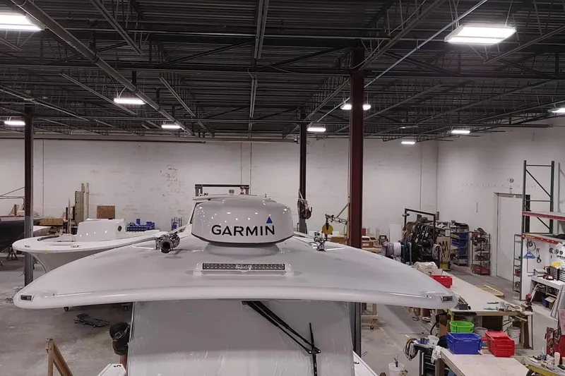 Slide: The Image of 2026 Southport 33 FE boat with Garmin equipment in workshop. - 11