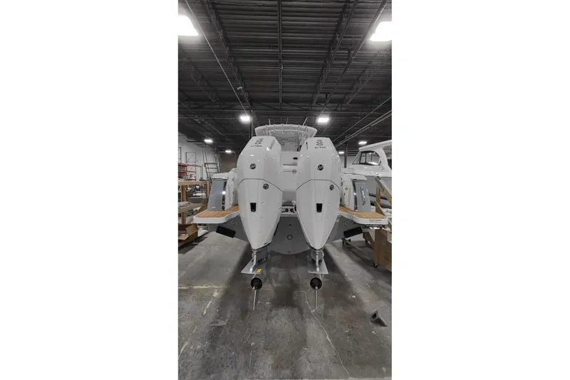 Slide: The Image of Rear view of Southport 33 FE boat, 2026 model, in a workshop. - 3