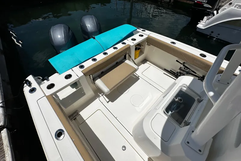 Slide: The Image of 2019 Pioneer 266 Pelagic boat interior with dual engines and seating area. - 18