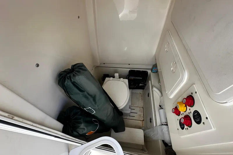 Slide: The Image of Interior of 2019 Pioneer 266 Pelagic boat with toilet and control panel. - 24