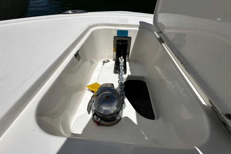 Slide: The Image of Anchor compartment of 2019 Pioneer 266 Pelagic boat with chain and winch. - 25