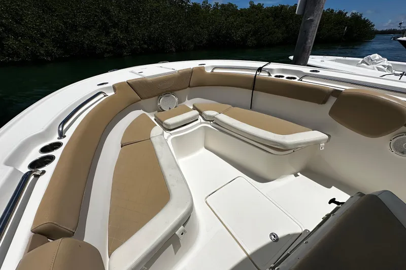 Slide: The Image of 2019 Pioneer 266 Pelagic boat interior with tan seating and stainless steel accents. - 27